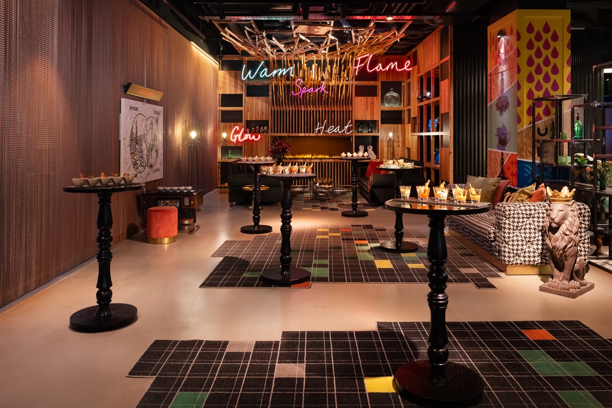 nhow_London_lobby_and_reception_fire_place_in_event_setting_high_tables_with_canapes