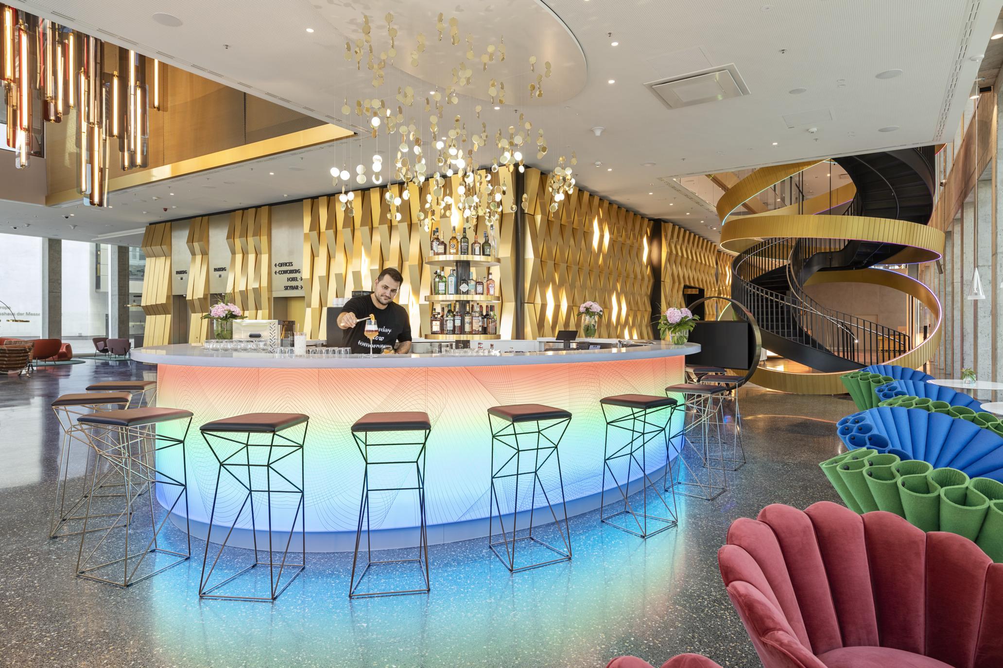 nhow_Frankfurt_Bar_interior_bartender_armchairs_tables-2064x1376