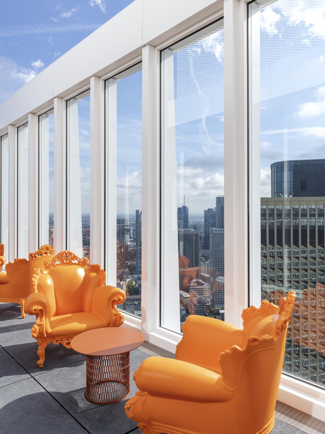nhow_Frankfurt_Bar_sky_bar_day_time_orange_armchair_table-1376x1835